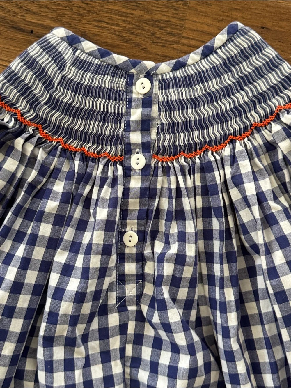 Cecil And Lou Navy Gingham Smocked Dress with Smocked Orange Pumpkin Embroidery